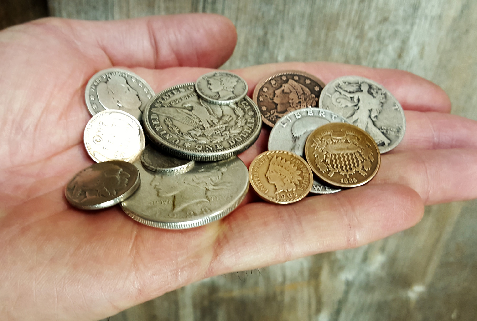 A handful of old coins can be turned into amazing decorative elements on cigar box guitars