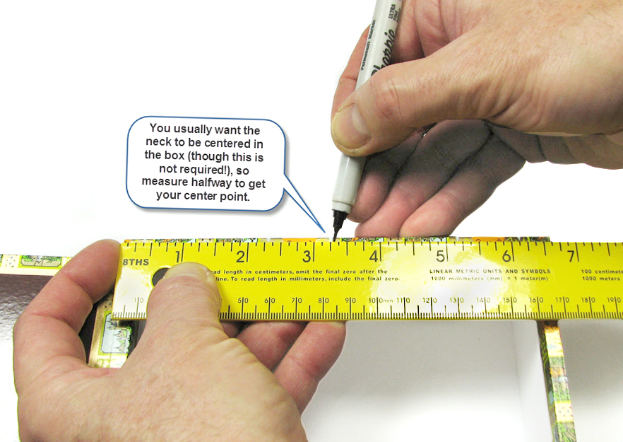 Measure and mark the center of both box sides through which the neck will extend.