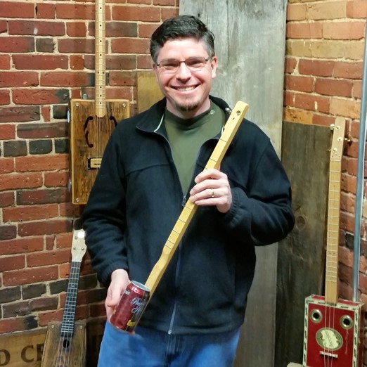 Ben Baker holding his first canjo