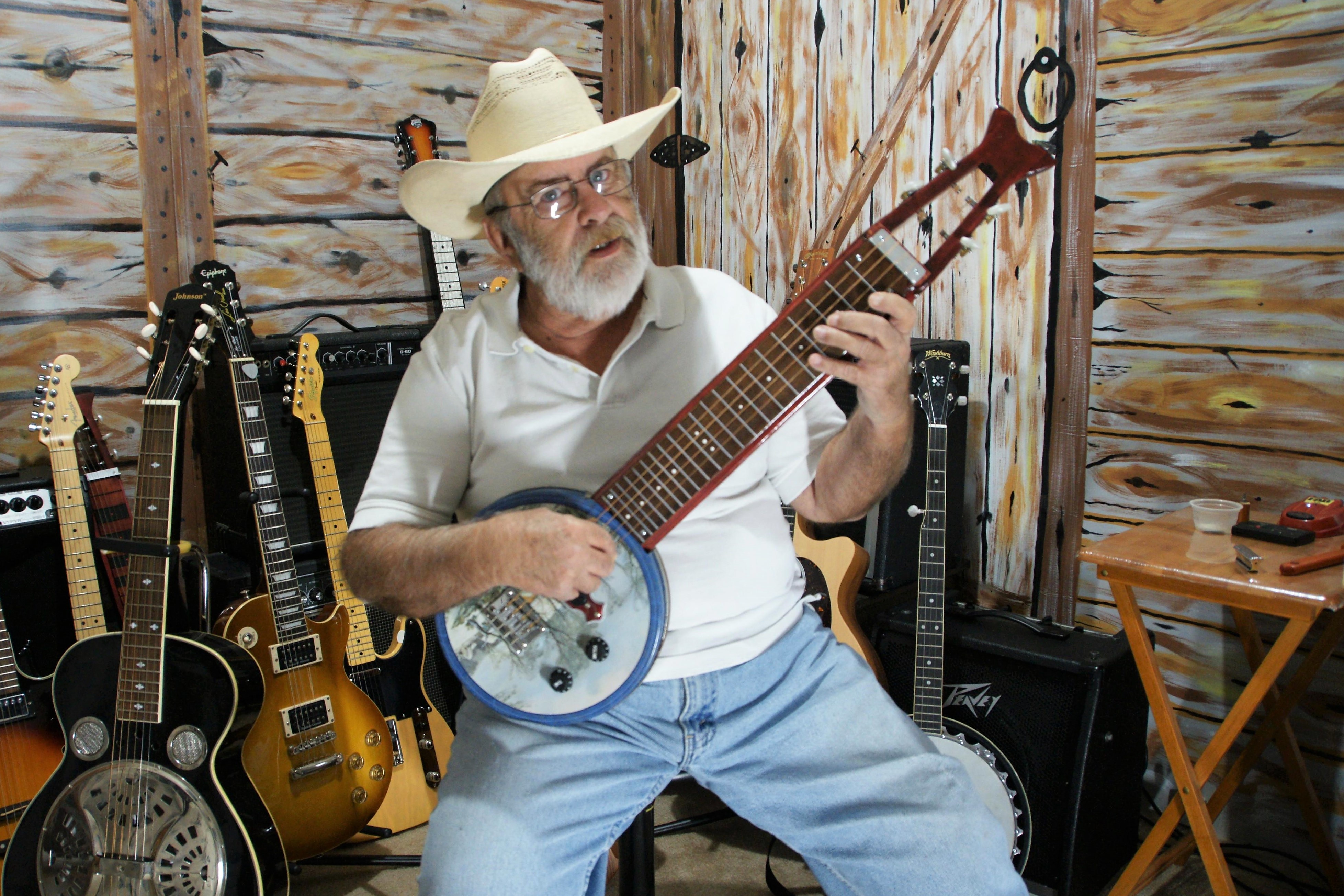 Danny J. with his 4-string cookie tin guitar