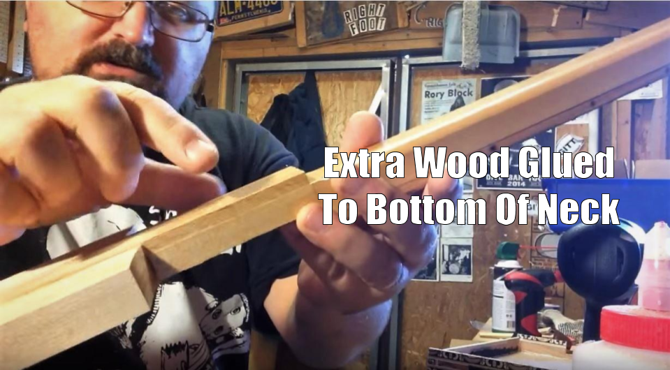 Shane Speal points to extra wood glued to the bottom of the neck