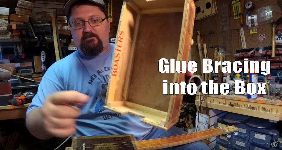 Shane Speal glues braces into antique cigar boxes