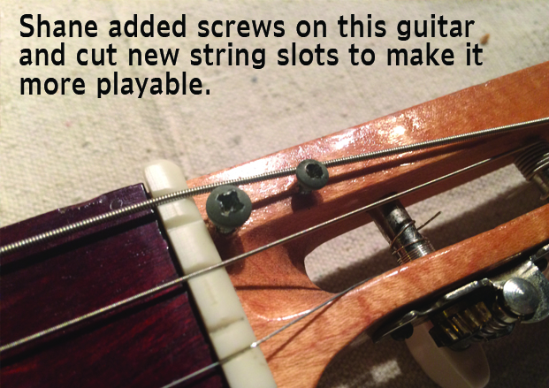 Shane Speal added string retaining screws to this cigar box guitar headstock