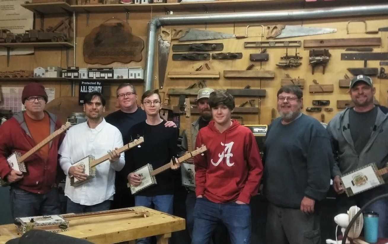 Jim B. with his cigar box guitar building class