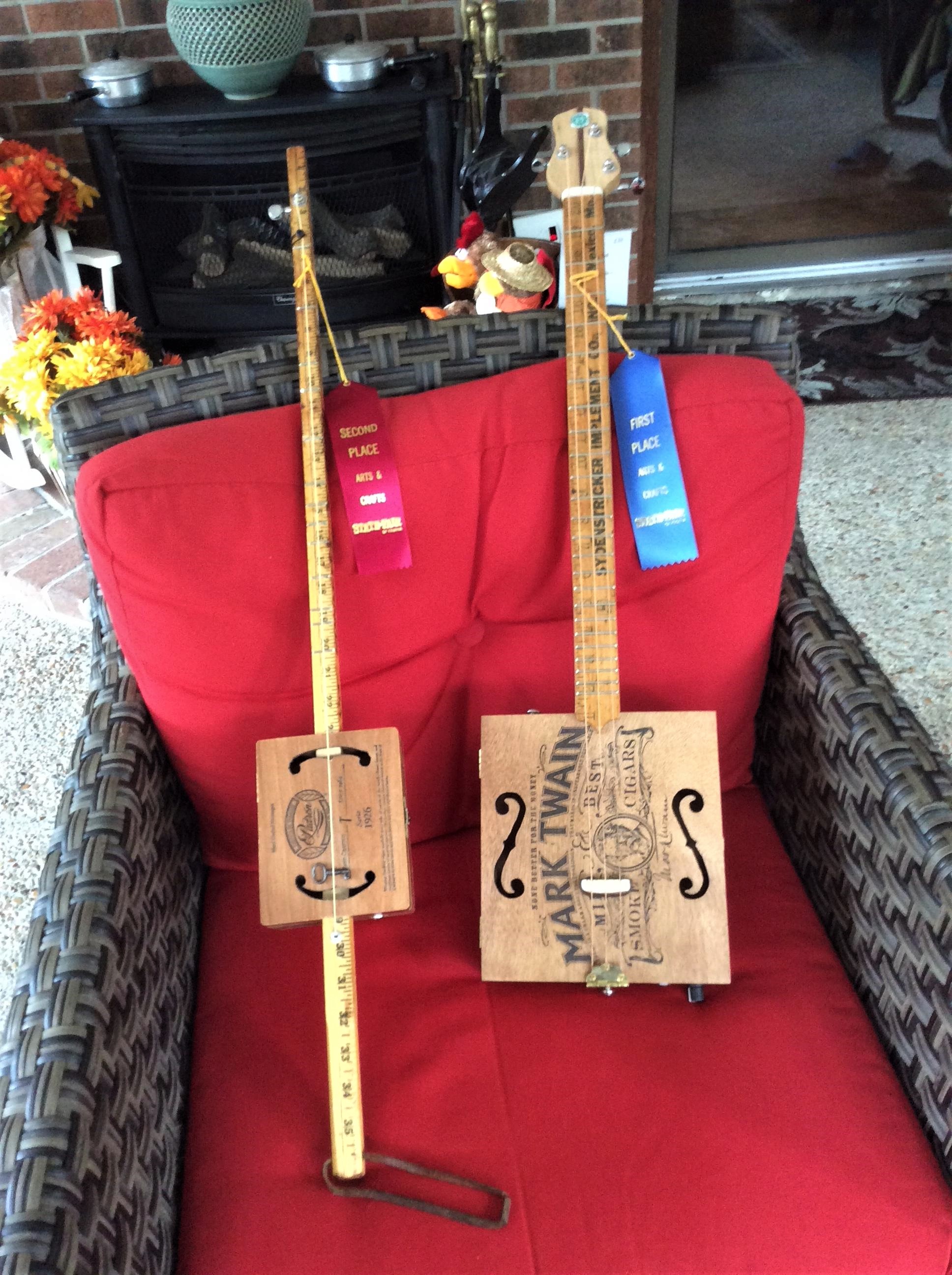 Virginia State Fair ribbon winning diddley-bow and 3-string cigar box guitars by Joe S.