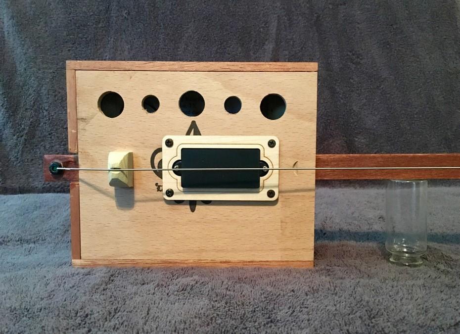 Poorness Studios' Bukey Bow: the one-string, electrified, tenor uke-scale, cigar box bass