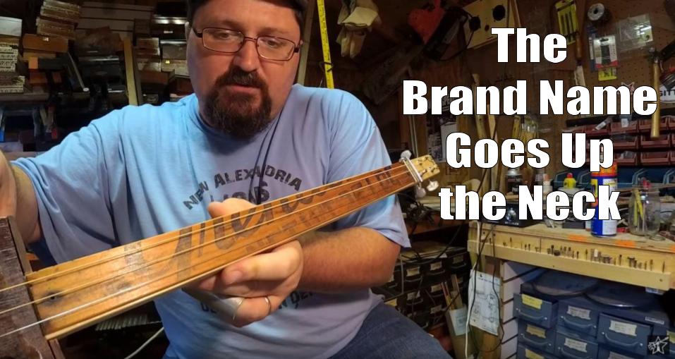 Shane Speal displays a fruit crate fretboard with the brand name displayed