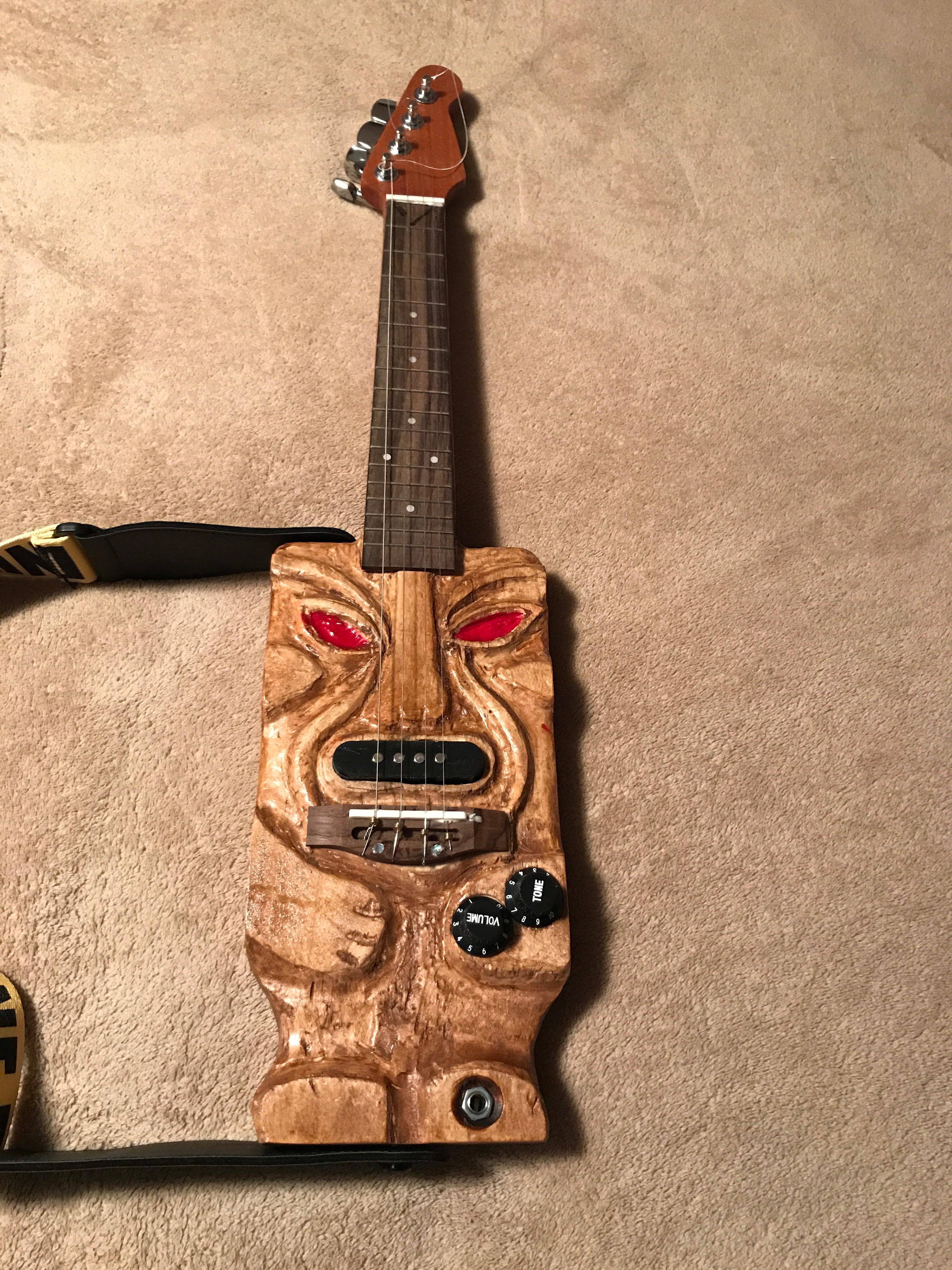 Hand-carved tiki ukulele by Thomas H.