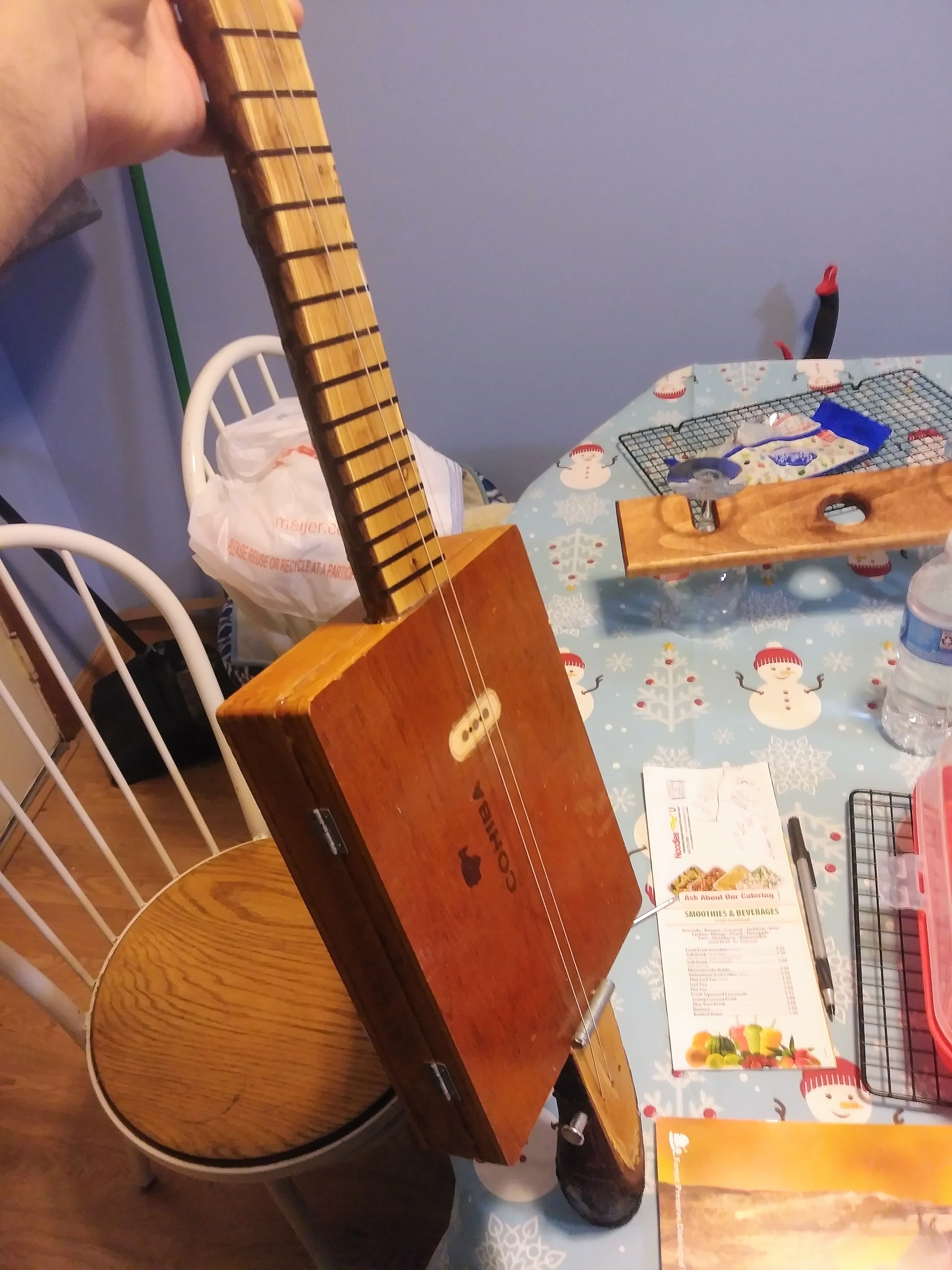 3-string cigar box guitar, apple branch-neck, by Thomas K.