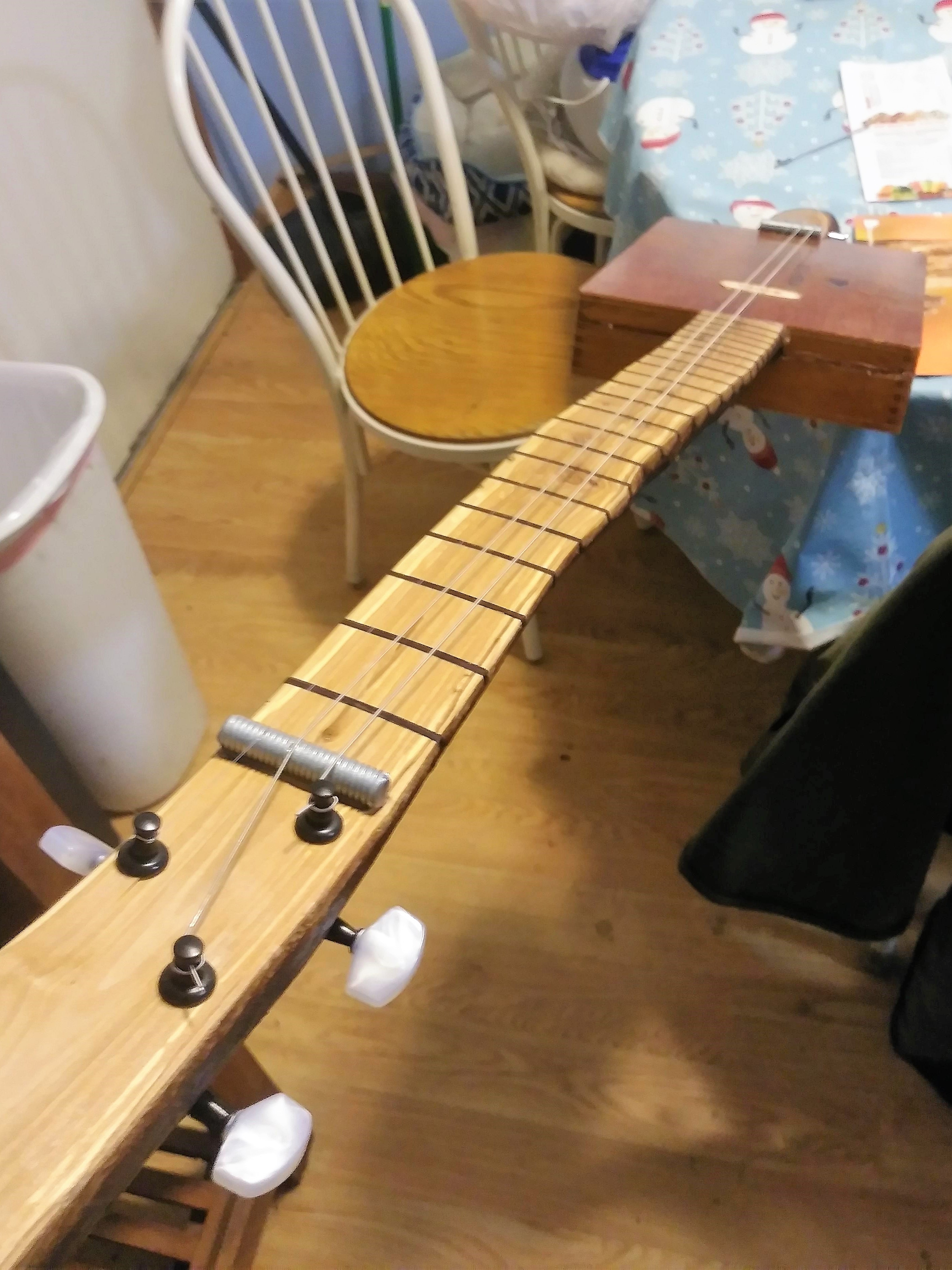 Apple branch-neck 3-string guitar by Thomas K.